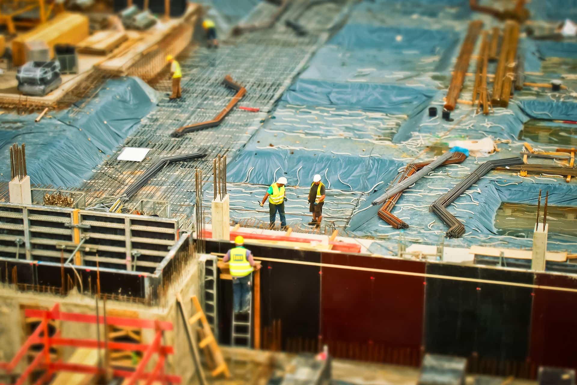 Field roots of Balance & Build Consulting on commercial construction sites Active commercial construction foundation site with rebar, formwork, and field crews